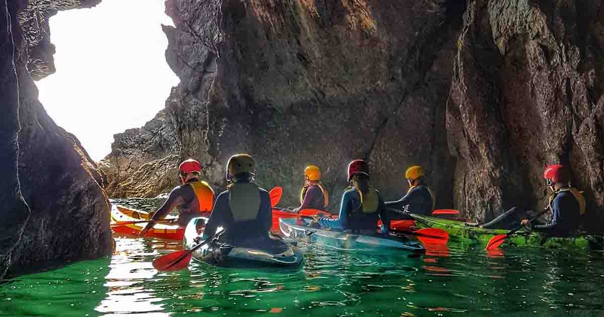 Kayakers in a sea cave